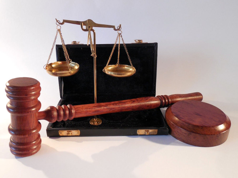 gavel, justice scales, and briefcase